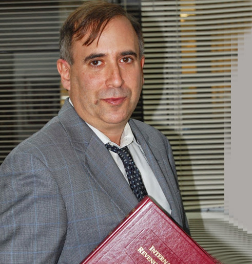 Attorney Daniel Silvershein holding a law book